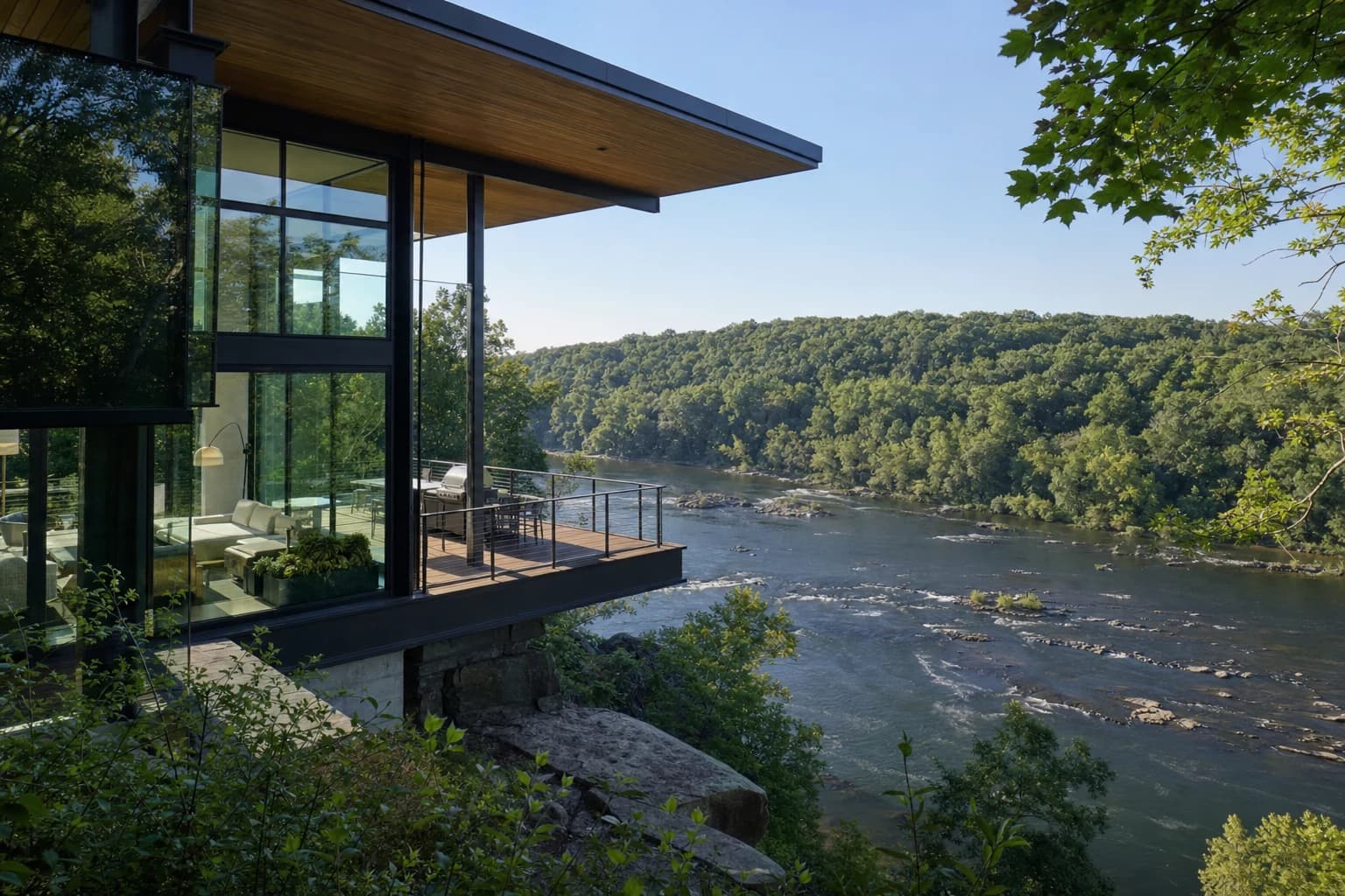 Modern luxury home with massive glass walls overlooking the Potomac River in Great Falls, Virginia