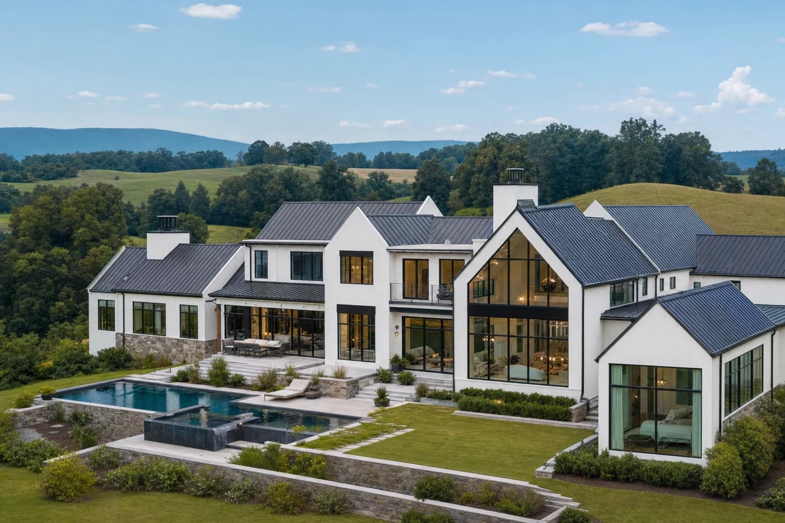 Sprawling modern luxury farmhouse sitting on 10 acres of rolling hills in Purcellville, Virginia, with massive black steel windows and a metal roof