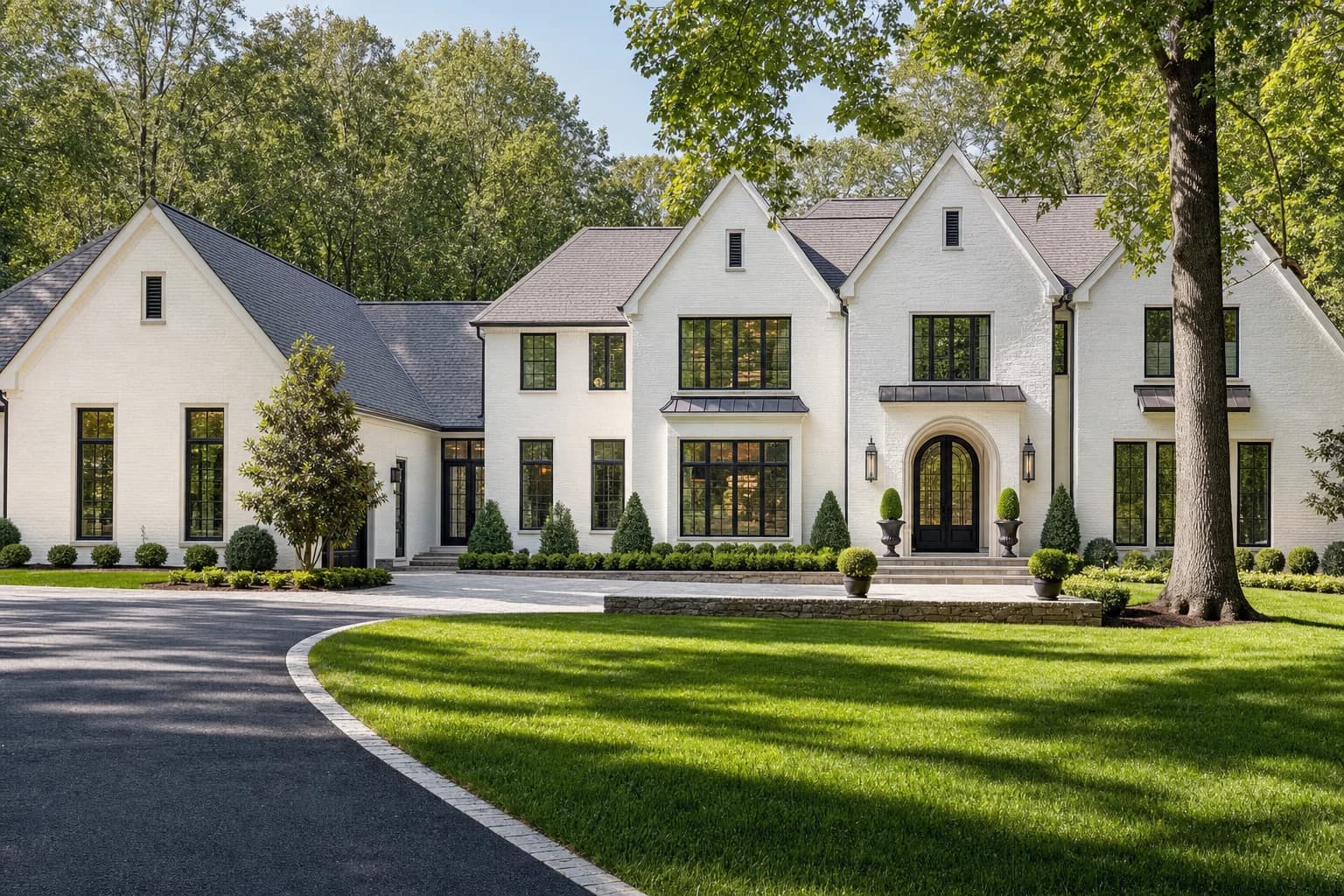 Luxury white painted brick transitional estate custom built on a deep wooded lot in Oakton, Virginia