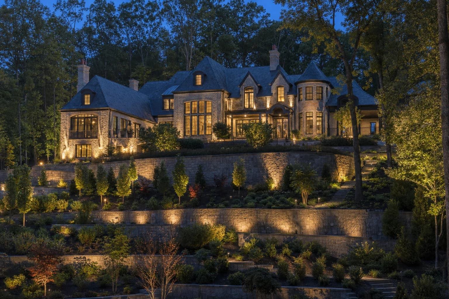 Luxury custom stone estate home on a steep wooded lot in Great Falls, Virginia
